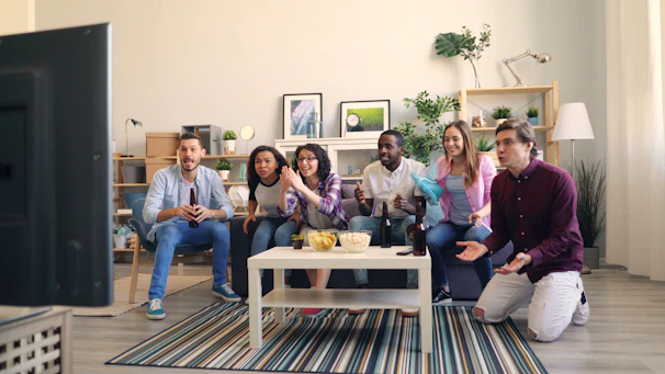 a group of people sitting in a living room