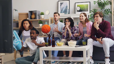 a group of people sitting around a living room