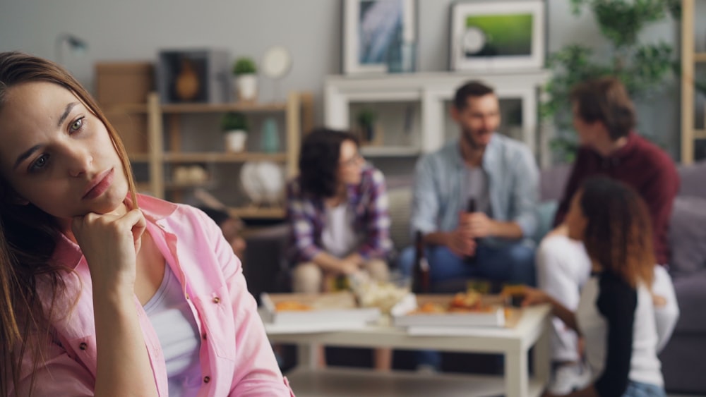 a group of people sitting around a living room