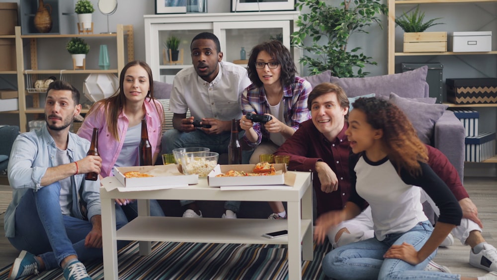 a group of people sitting around a coffee table