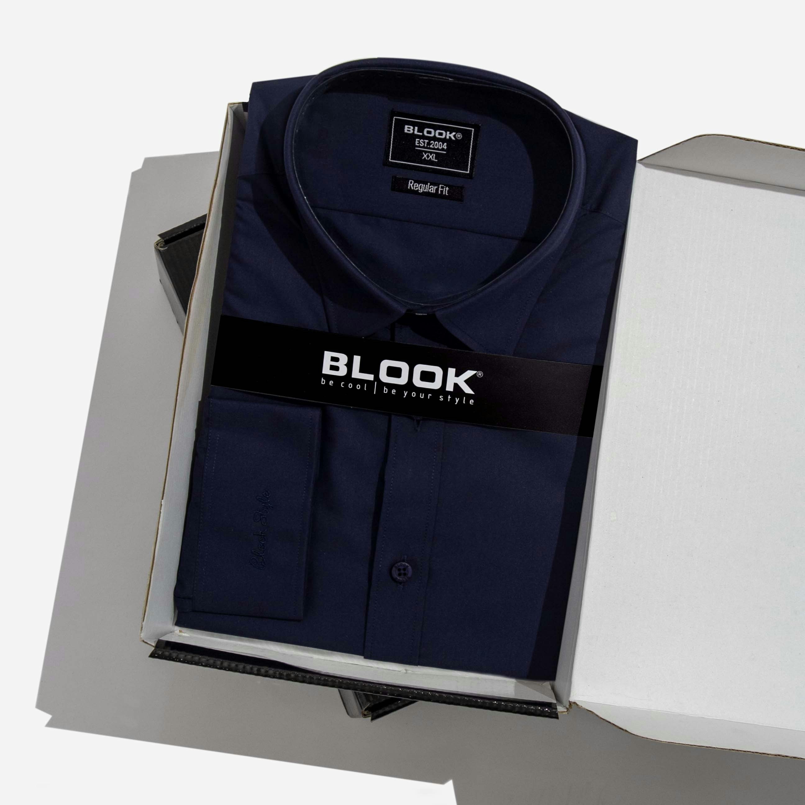 Premium branded corporate apparel neatly folded in dark atmospheric packaging studio