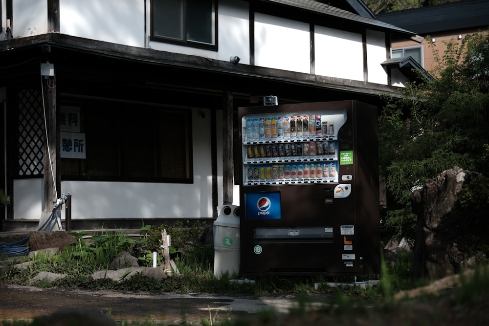 a vending machine in front of a house