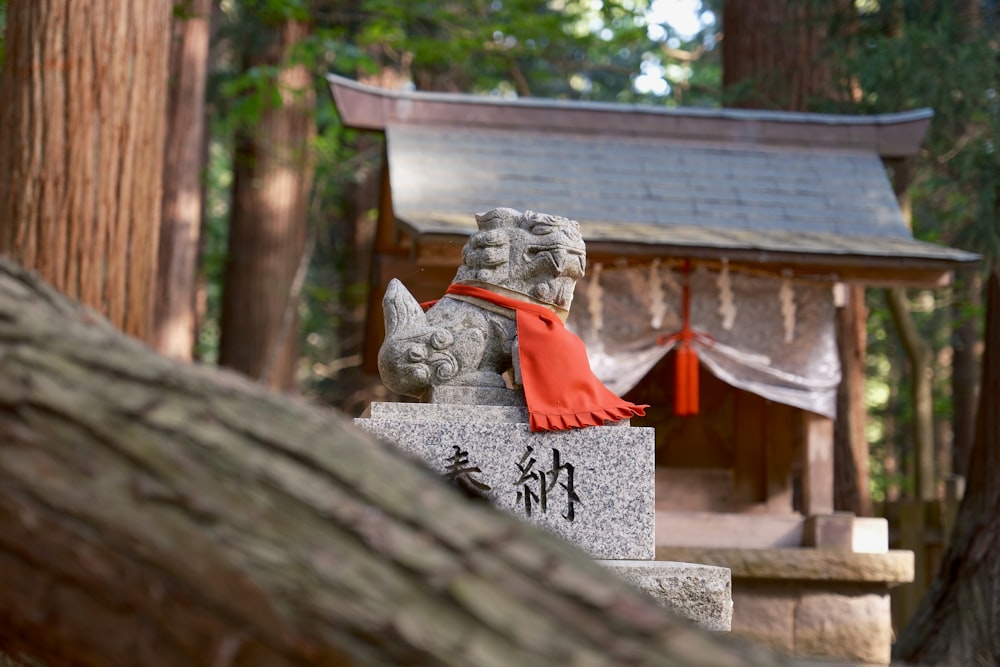 a statue of a dog with a red scarf around its neck