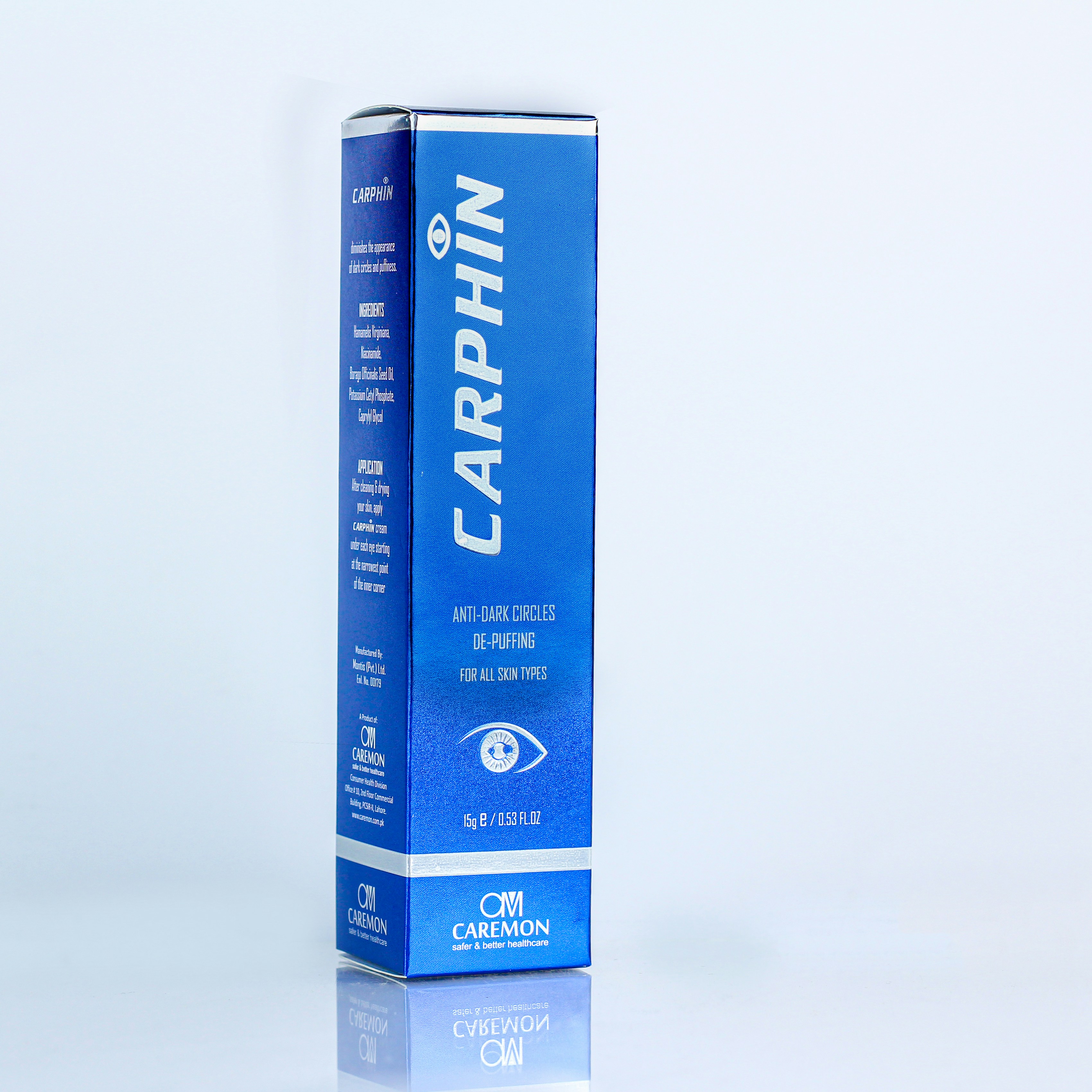 a blue carton of toothpaste on a white background