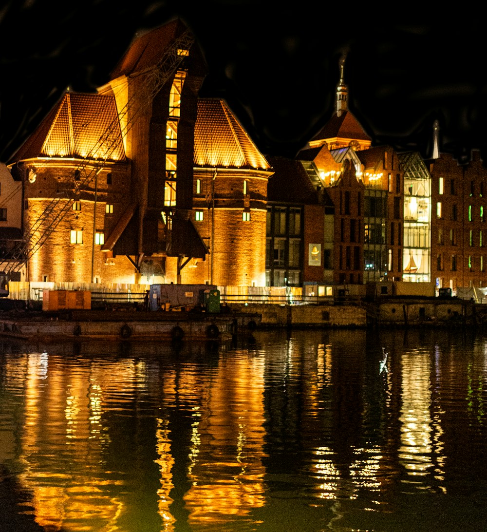 a large building sitting next to a body of water