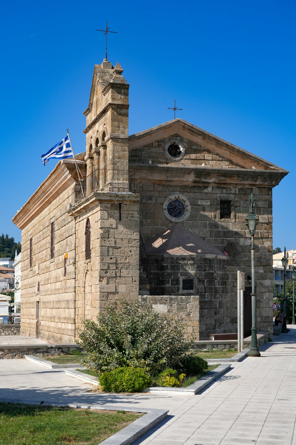 an old church with a flag on top of it