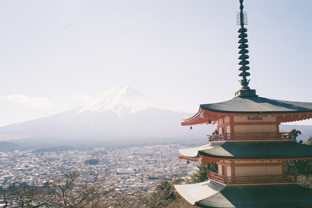 a view of a mountain with a pagoda in the foreground