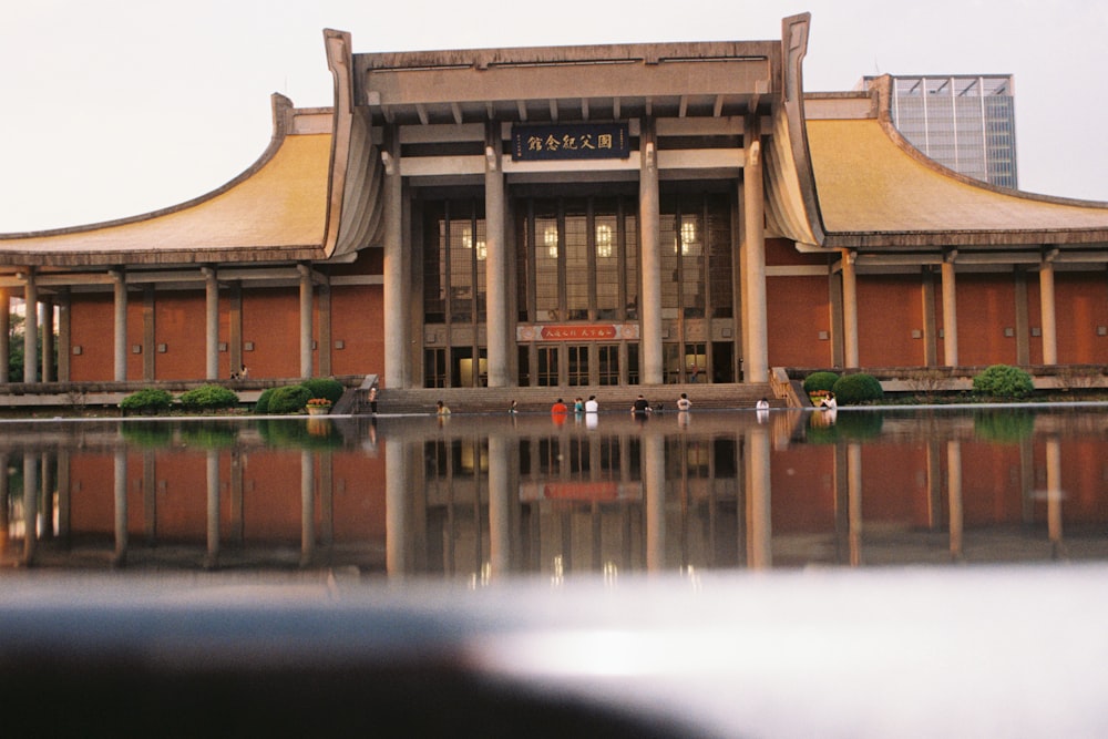 a reflection of a building in a body of water