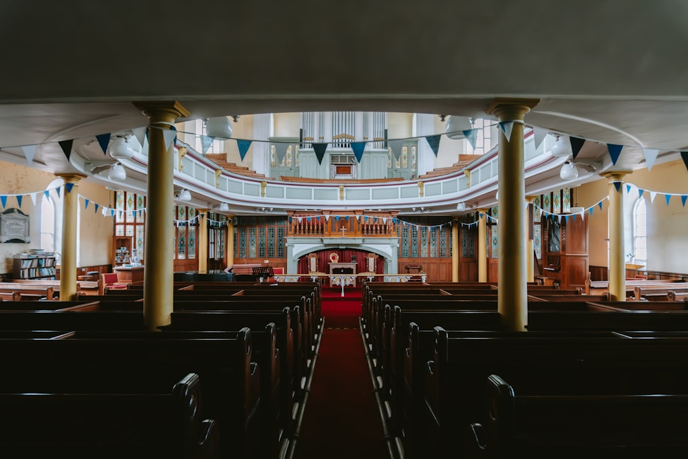 the interior of a church with rows of pews