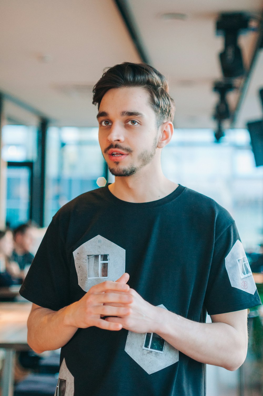 a man holding a glass of wine in his hands