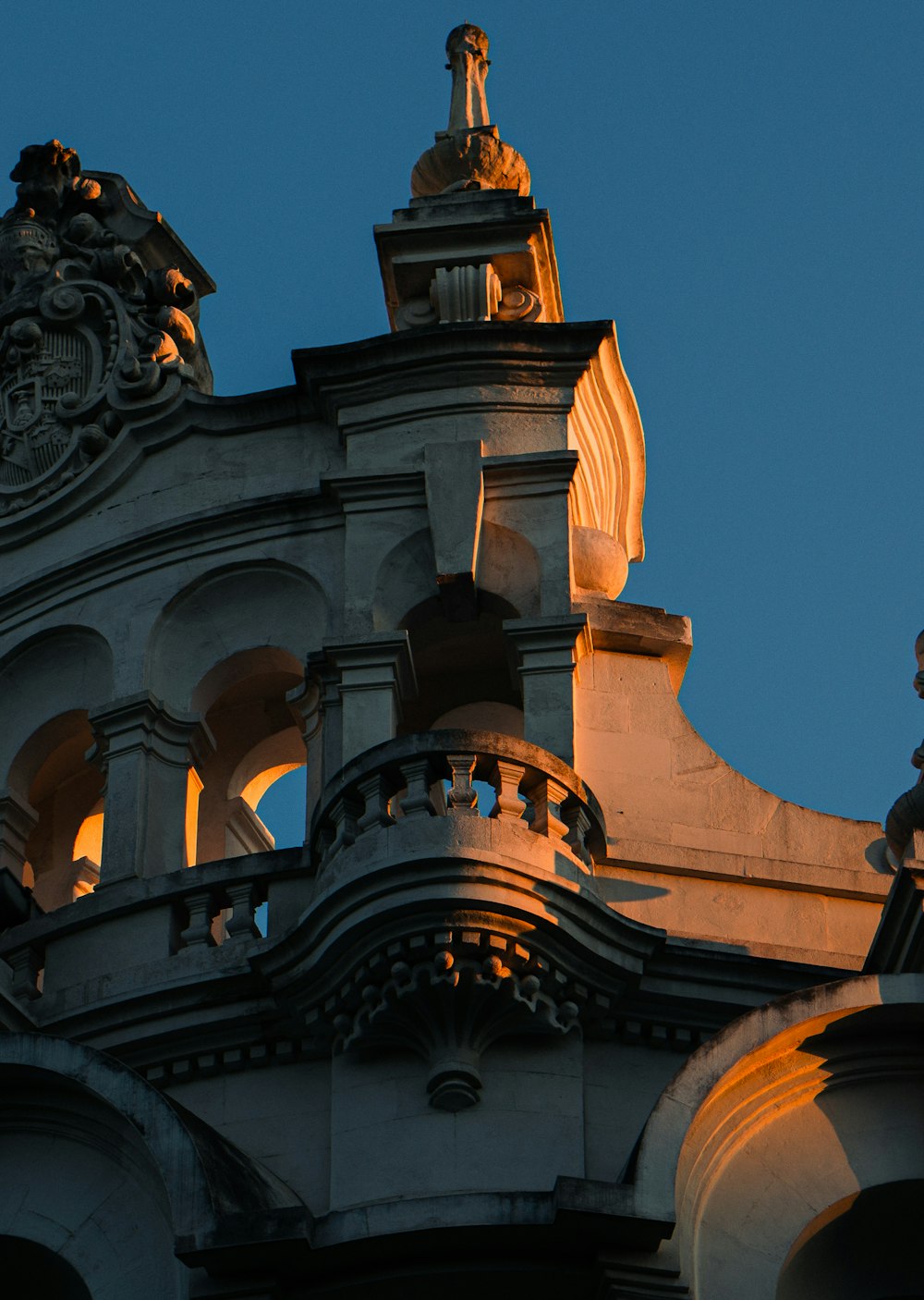 the top of a building with a clock on it