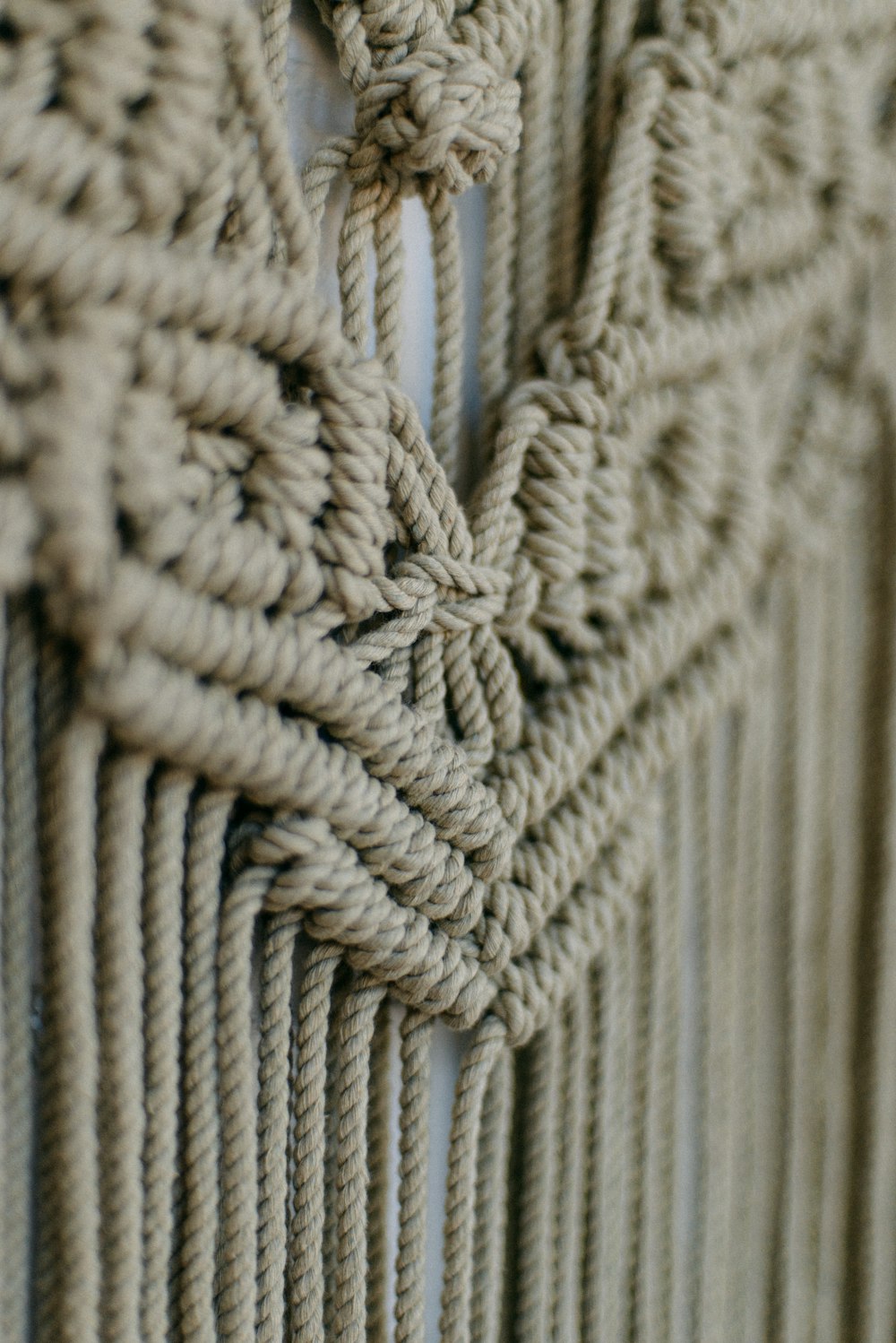 a close up of a wall hanging made of rope