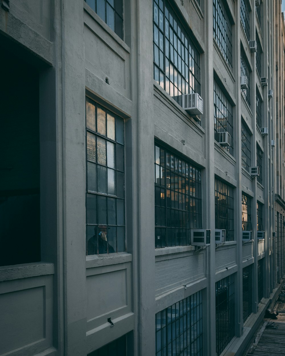 a building with many windows and bars on the side of it