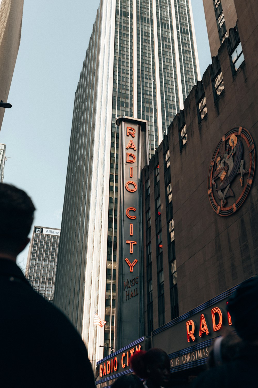 a tall building with a radio city sign on it's side