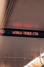 a red sign that says world trade ctr