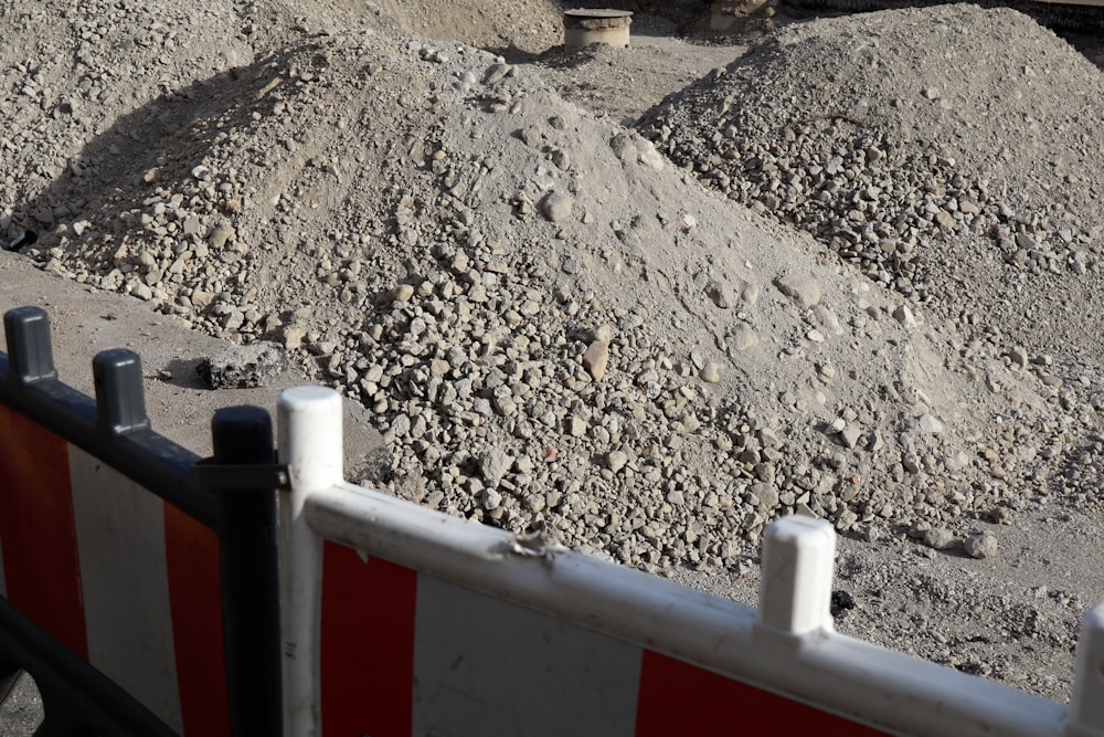 a large pile of dirt sitting next to a road