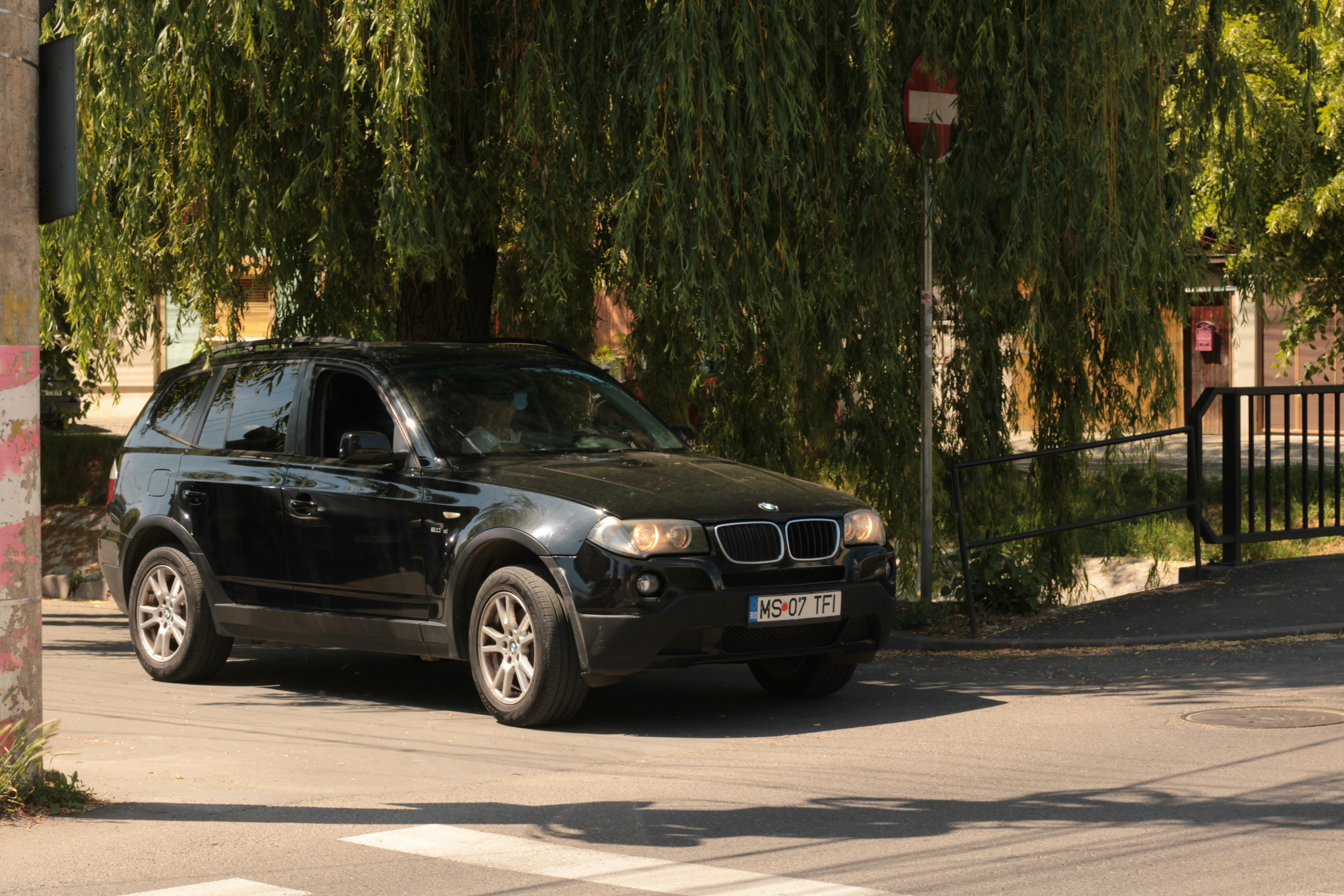 Interior of a BMW i4 showing the curved dual-screen dashboard and premium materials