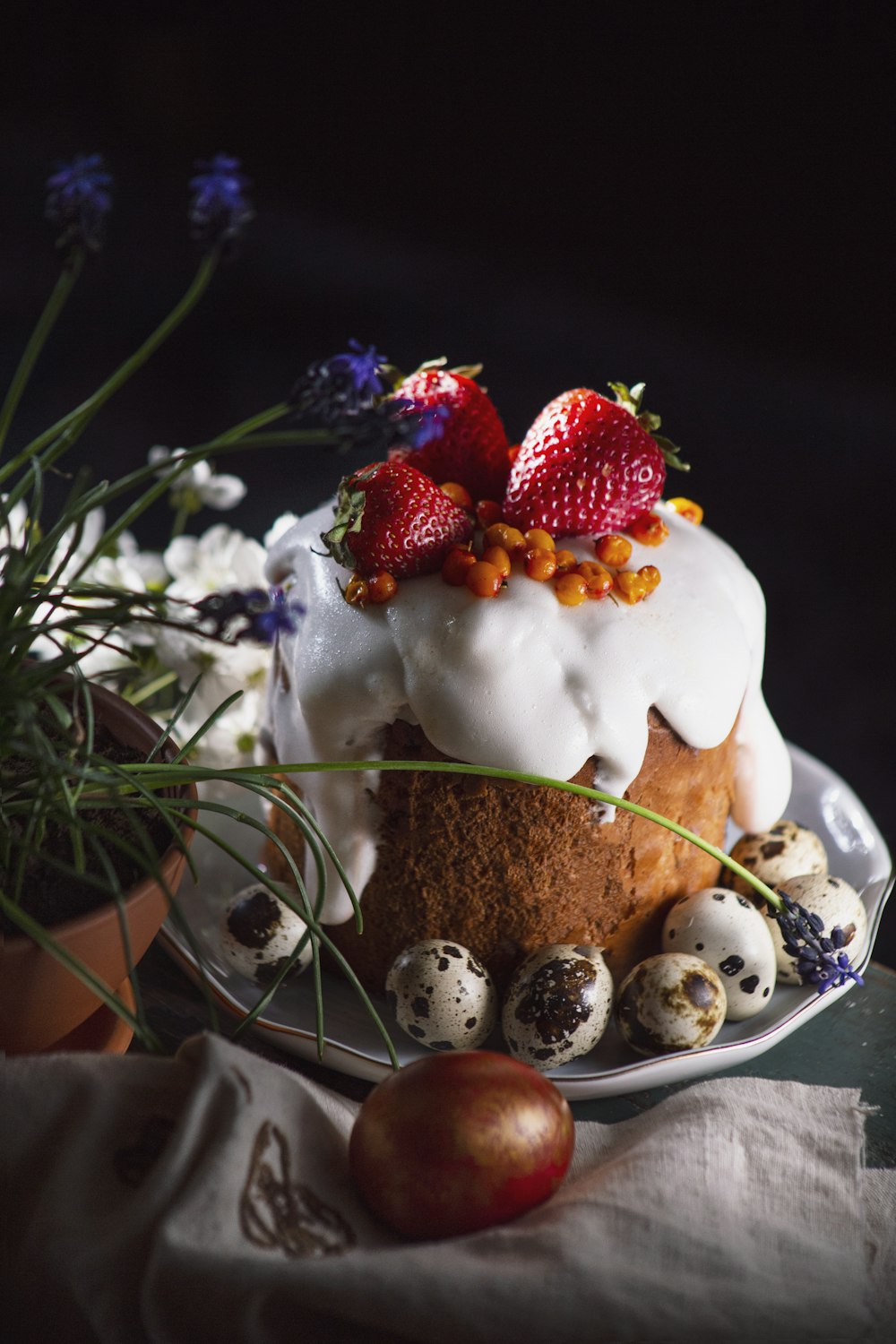 a cake with strawberries on top of it on a plate