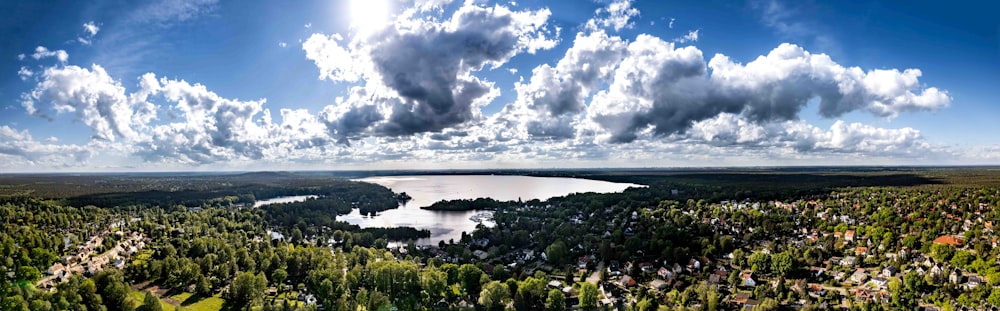 an aerial view of a lake surrounded by trees