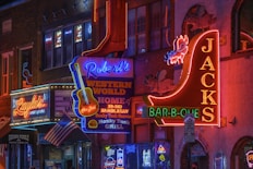 a city street filled with lots of neon signs
