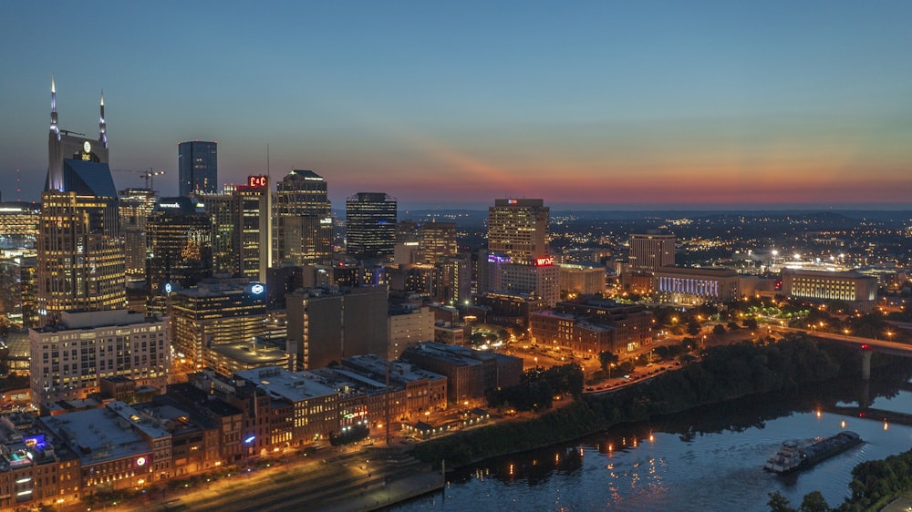 a view of a city at night from the top of a hill