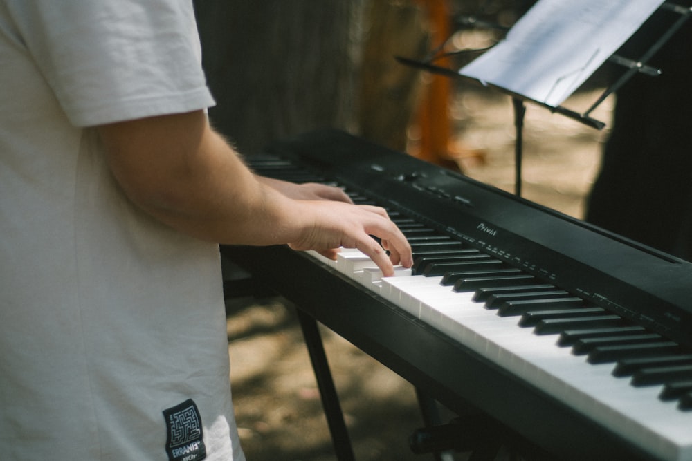 a person is playing a piano outside