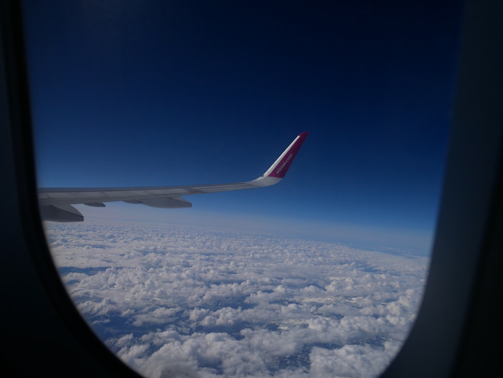 a view of the wing of an airplane in the sky