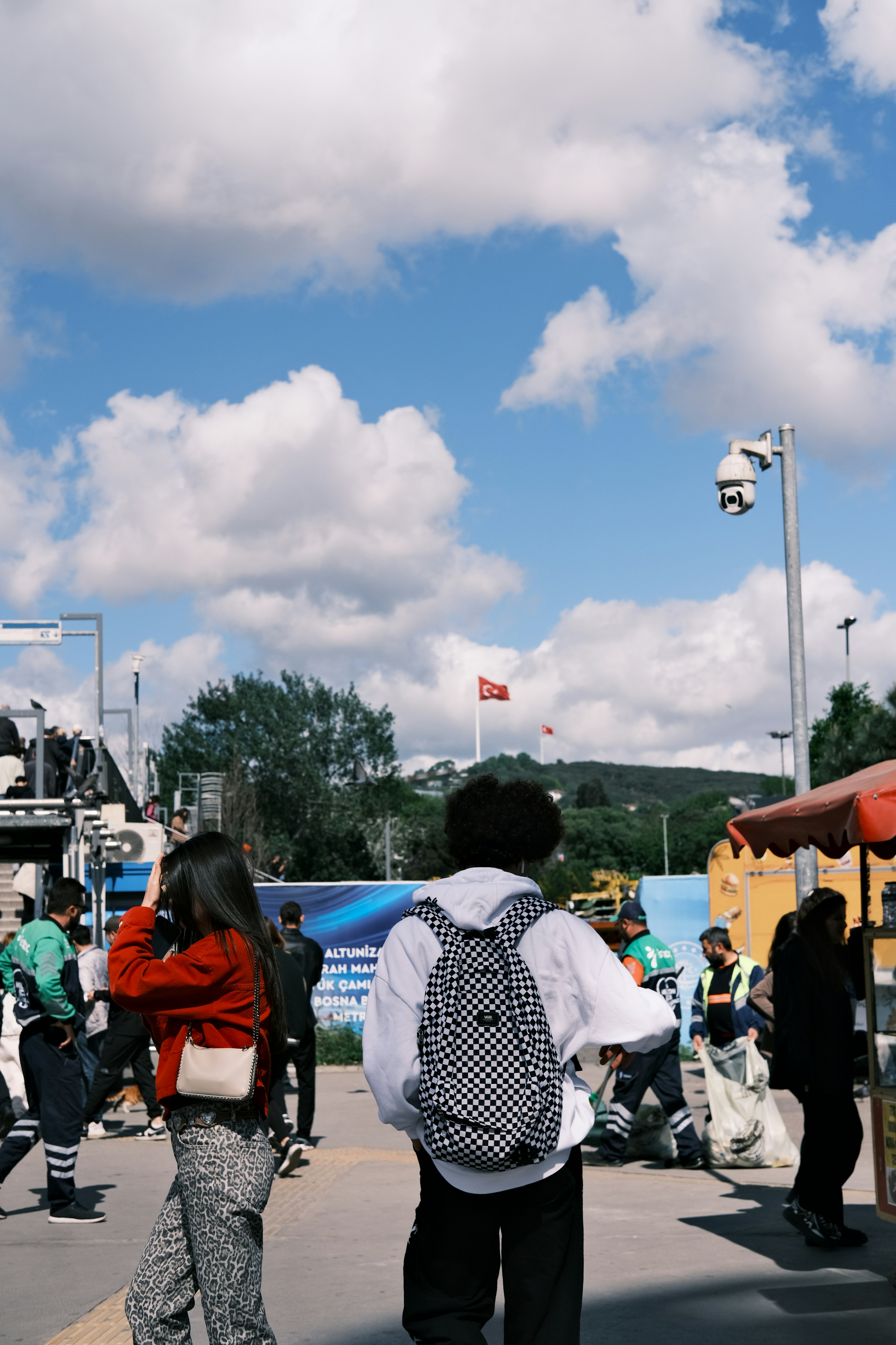 a man and a woman walking down a street