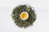 a cup of green tea on a white background