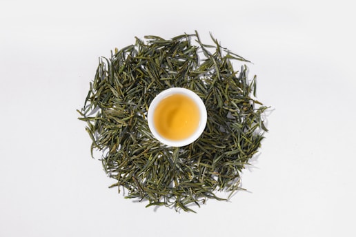 a cup of green tea on a white background