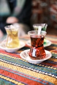 a cup of tea on a plate on a table