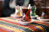 a cup of tea on a plate on a table