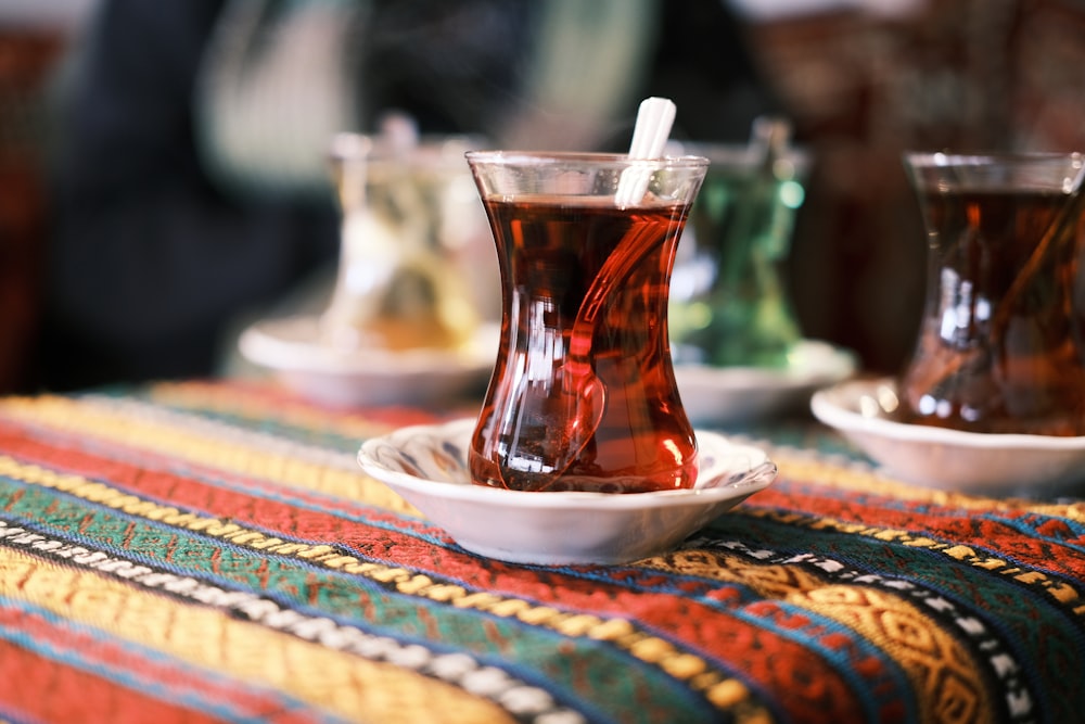 a cup of tea on a plate on a table