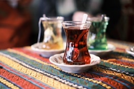 a cup of tea on a plate on a table