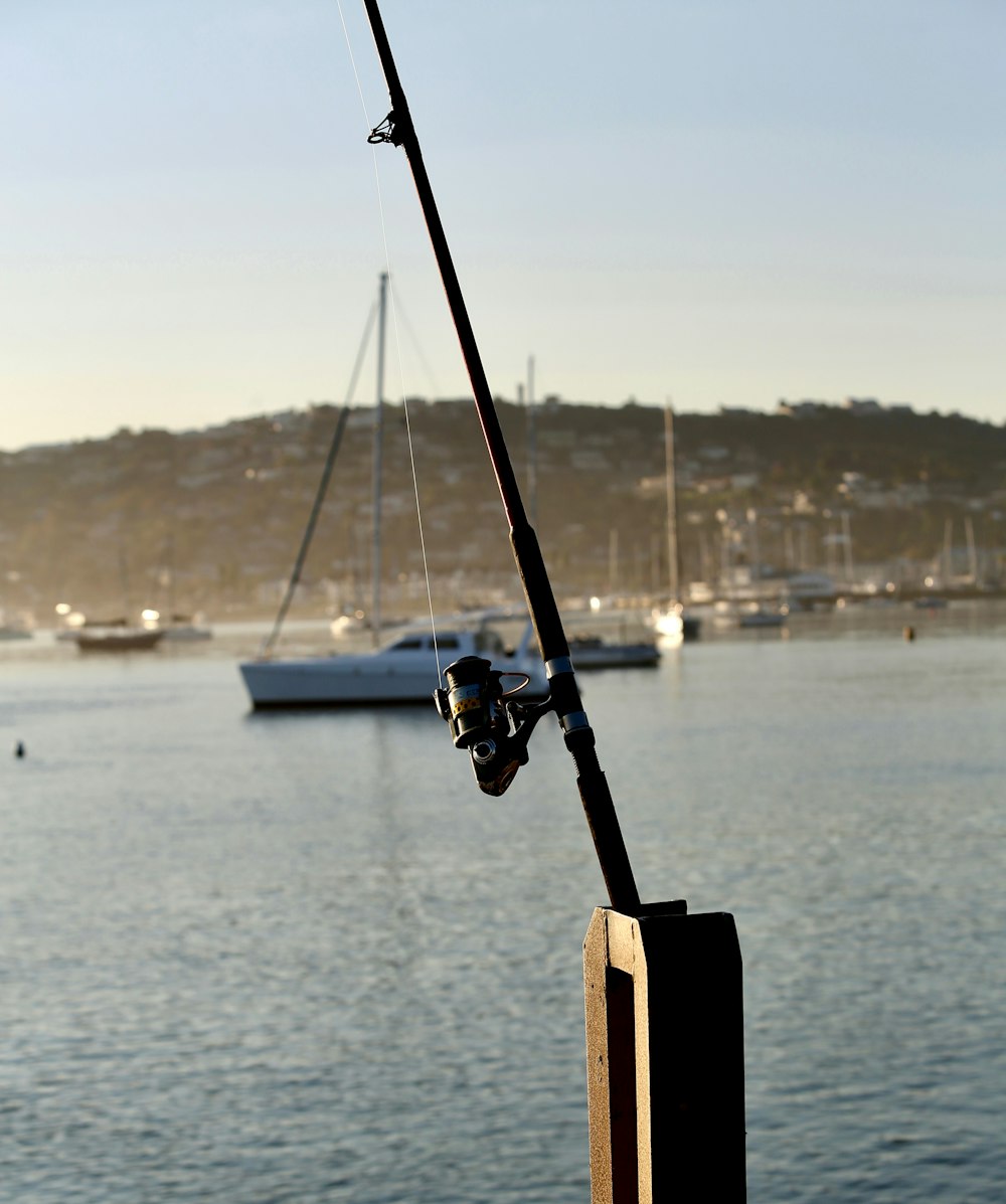 a fishing rod is attached to a pole in the water