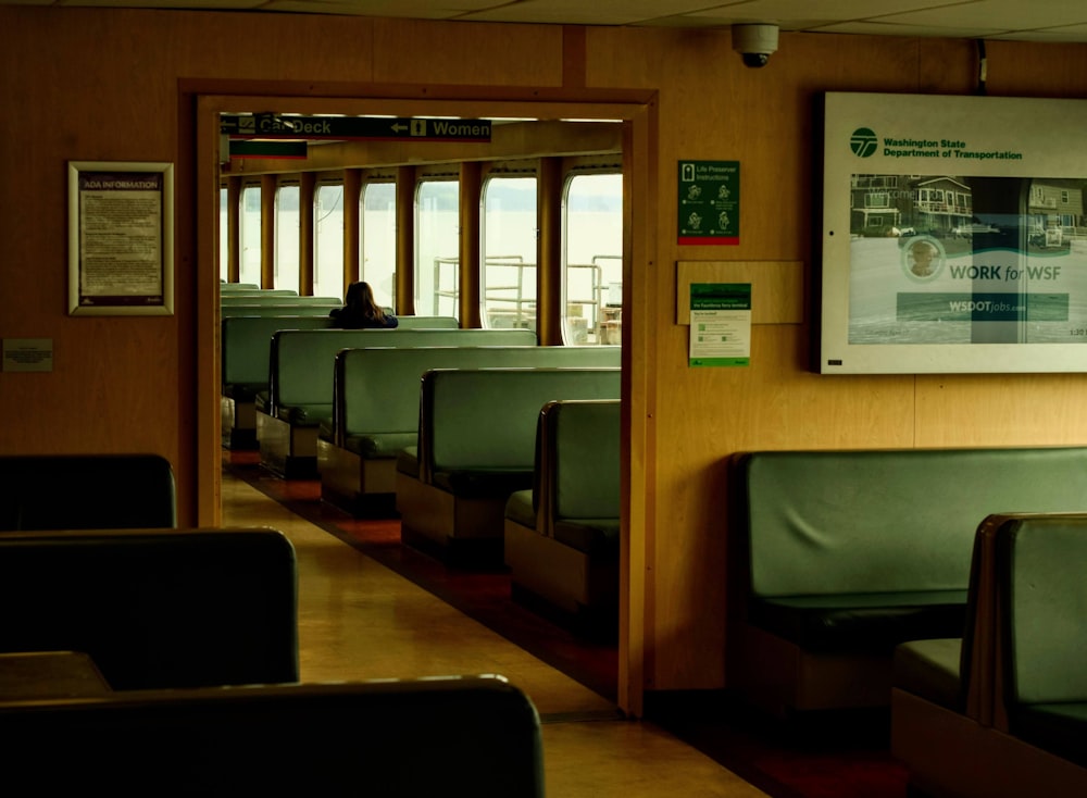 a train car filled with lots of seats next to a window