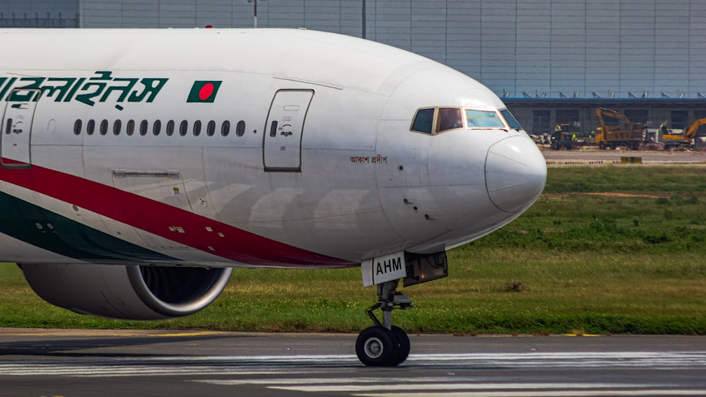 a large jetliner sitting on top of an airport runway