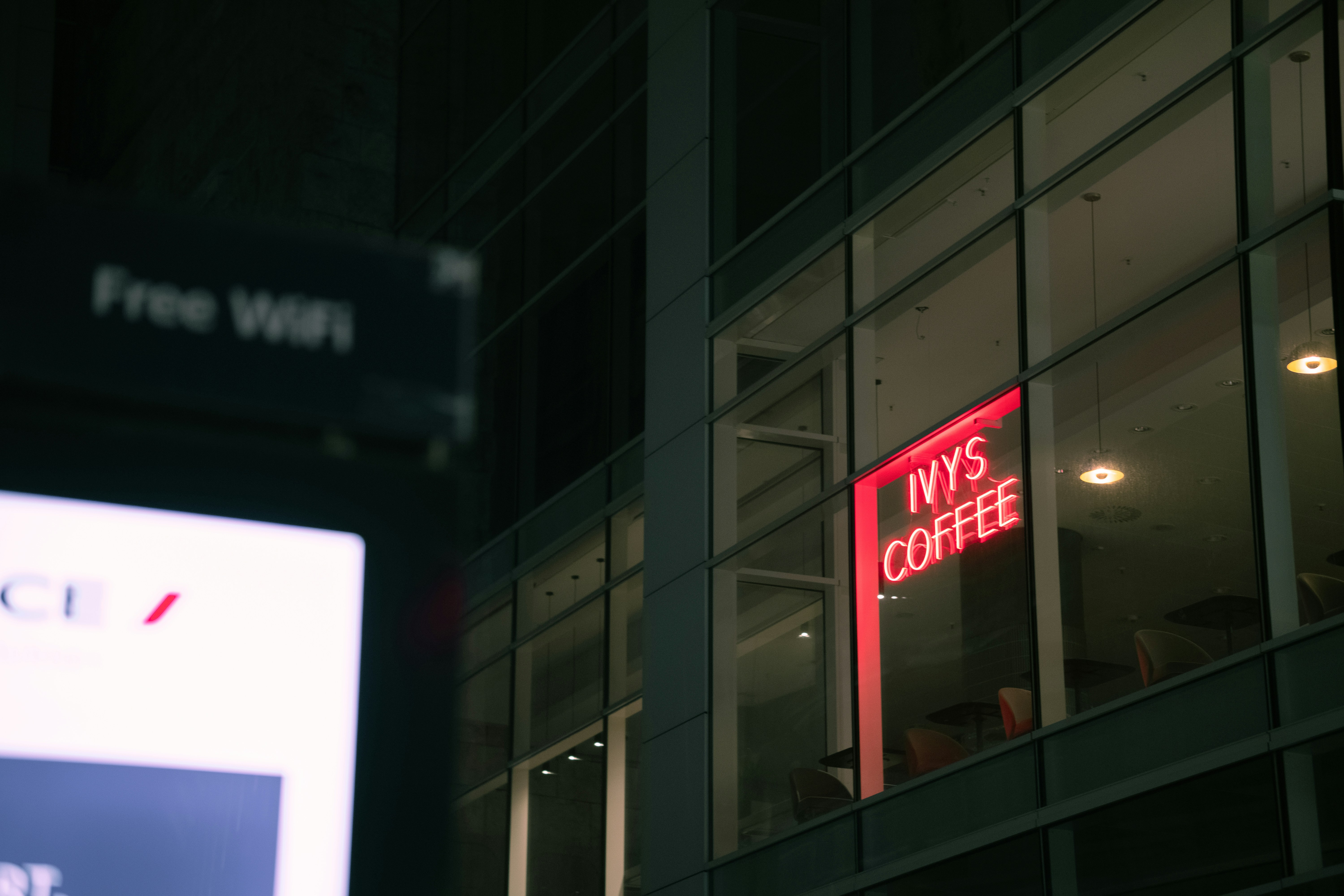 a red neon sign that reads nys coffee