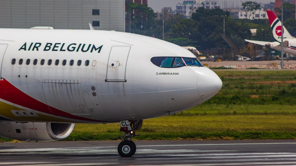 a large jetliner sitting on top of an airport runway