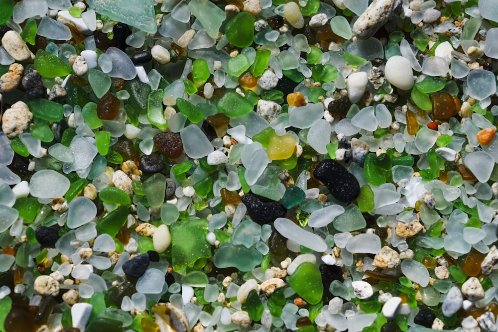 a mixture of sea glass on a beach