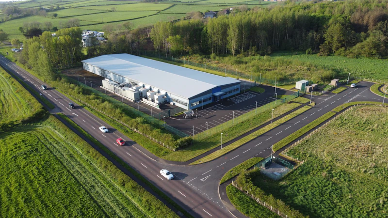Aerial view of a data center beside a road