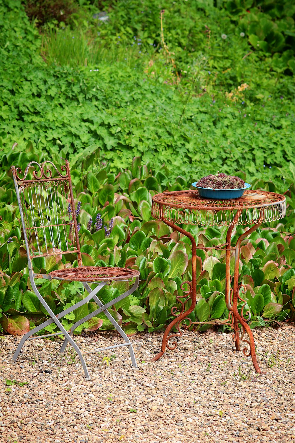 a couple of chairs sitting next to a table