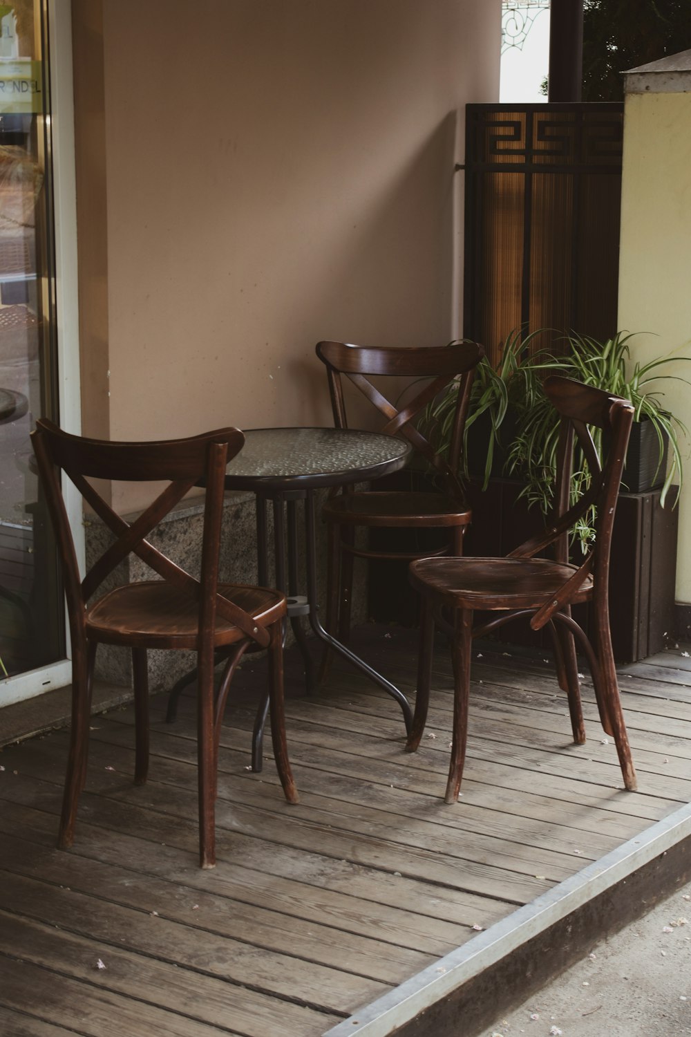 a couple of wooden chairs sitting on top of a wooden floor