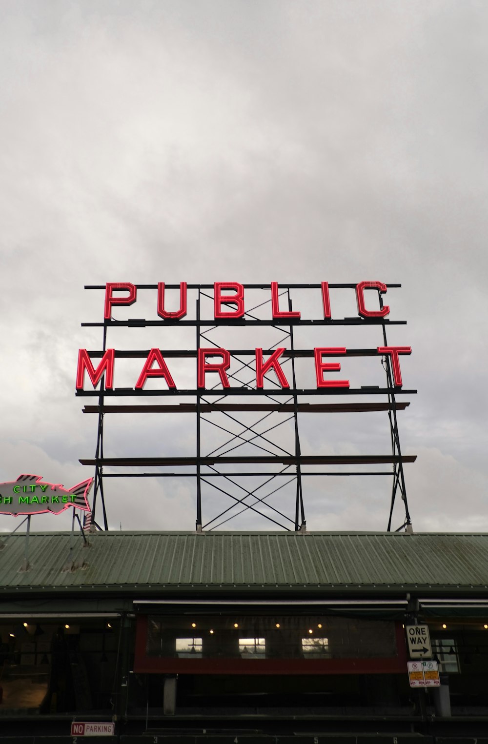 a public market sign on top of a building