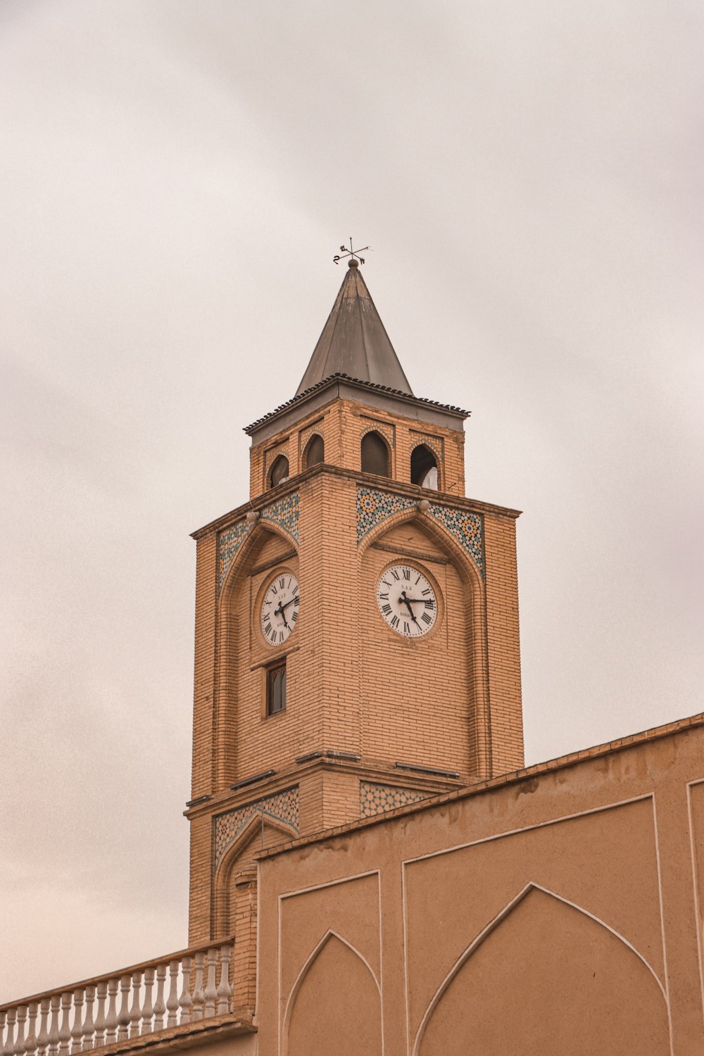 a tall tower with a clock on the top of it