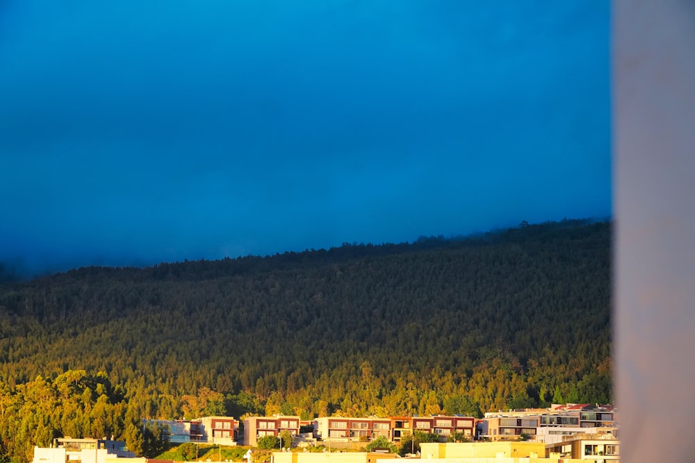 a view of a city with a mountain in the background