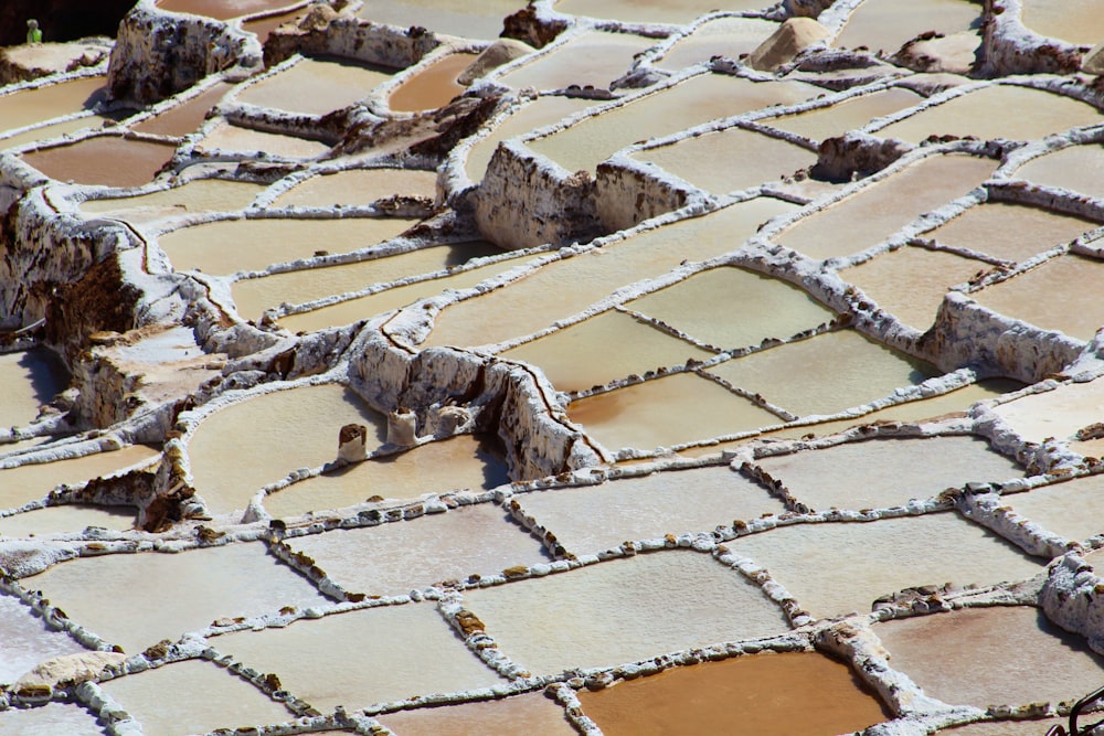 a view of a cobblestone street with snow on the ground