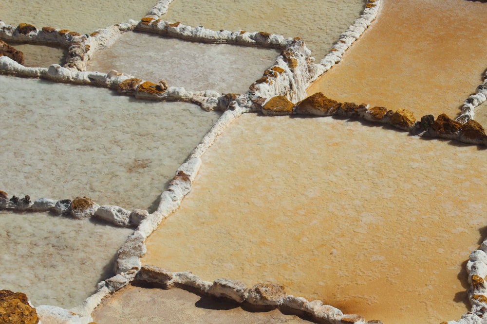 a close up of a tile floor with different colors