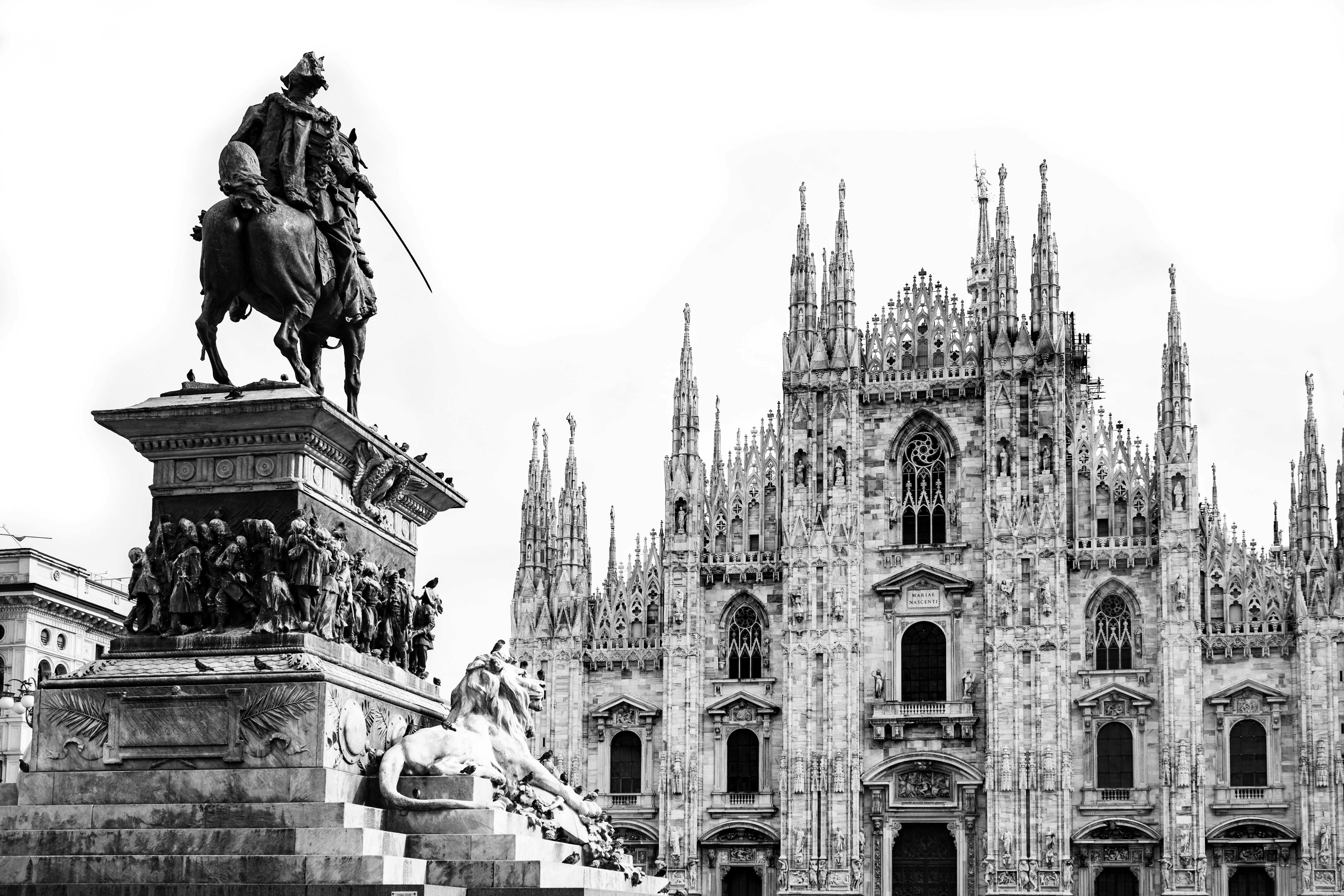 a black and white photo of a statue of a man on a horse (Photo by Mikhail Mamaev on Unsplash)