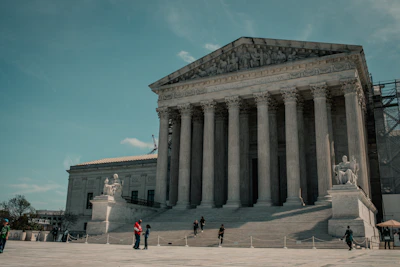 a group of people standing in front of a building